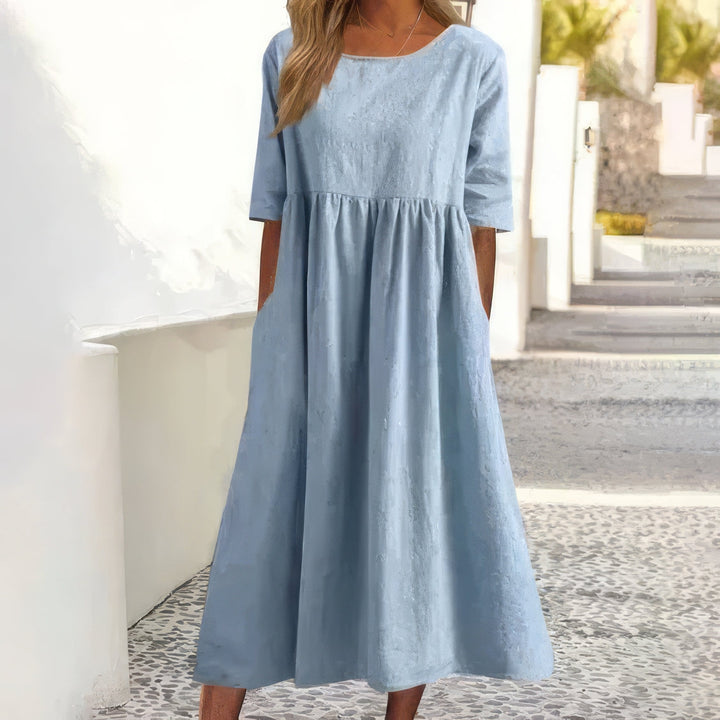 Vestido de algodão com decote redondo e bolsos