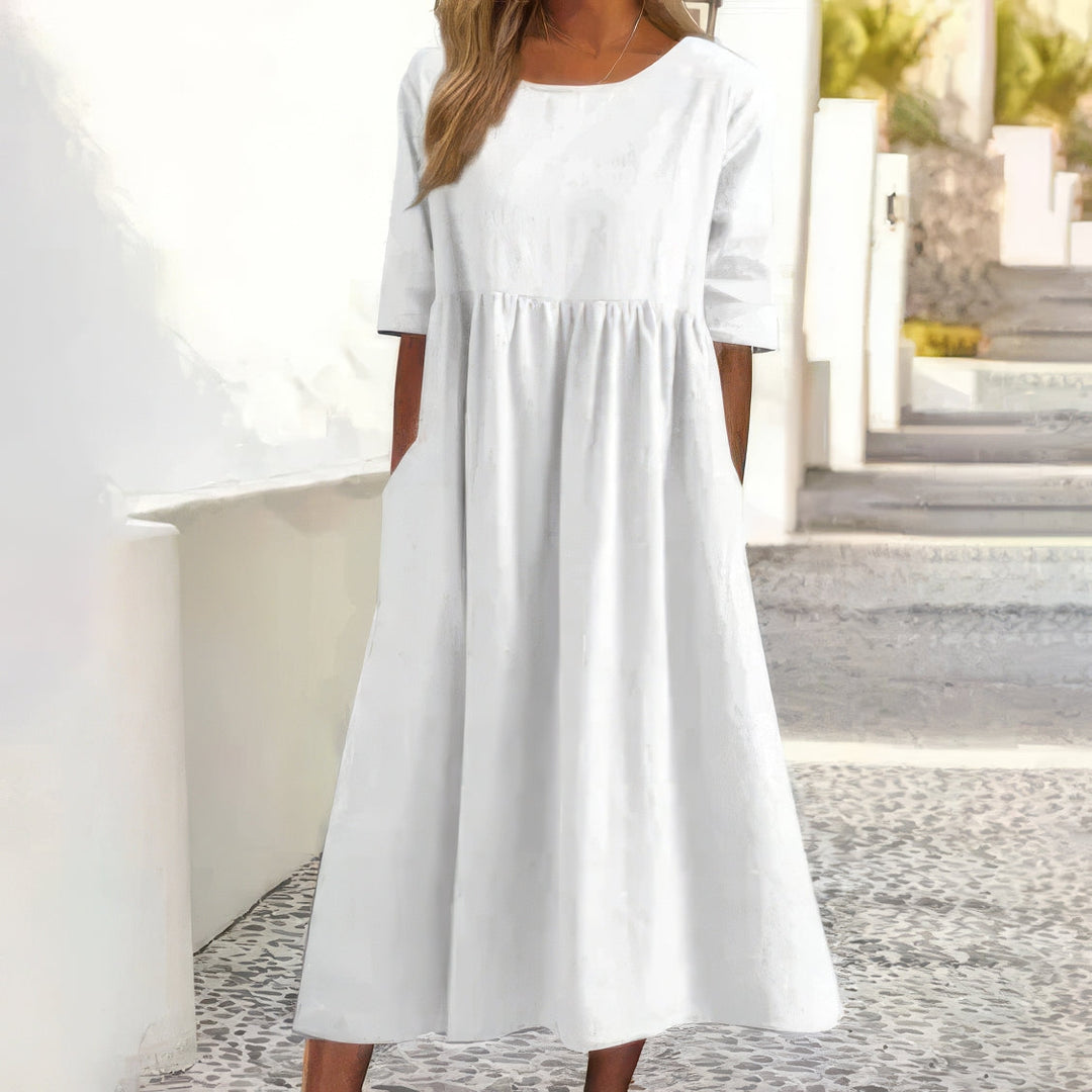 Vestido de algodão com decote redondo e bolsos